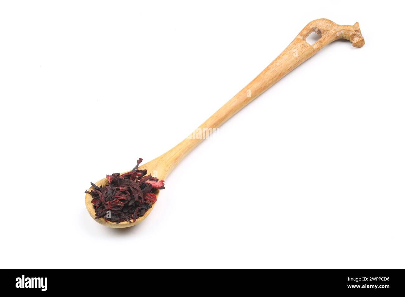 Karkade tea. Hibiscus tea leaves in wooden spoon isolated on white background. File contains clipping path. Top view. Stock Photo