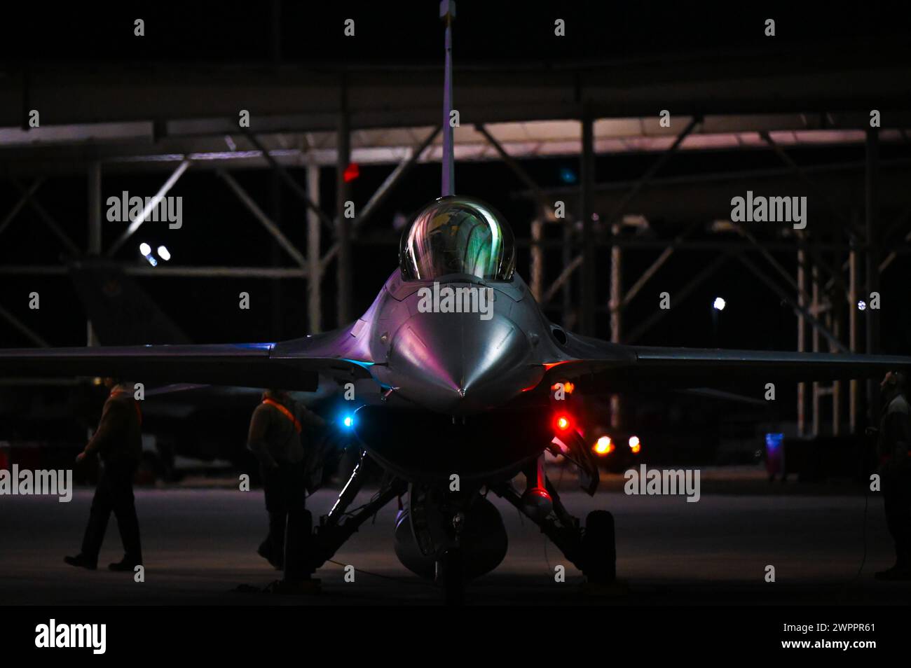 U.S. Air Force maintainers prepare an F-16C Fighting Falcon assigned to the 79th Fighter Squadron, to fly during a South Carolina Electronic Warfare Range (SCEWR) exercise at Shaw Air Force Base, S.C., Dec. 13, 2023. The SCEWR initiative is employed in  exercises aimed at replicating a more realistic combat scenario to better challenge the capabilities of the wing’s pilots, fighter aircraft and maintainers. It requires combining several local airspaces in partnership and coordination with the Federal Aviation Administration (FAA)  to allow pilots to train in a wider force exercise training sce Stock Photo