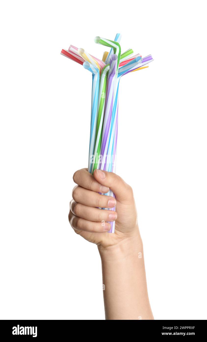 Woman holding bunch of plastic straws on white background, closeup ...