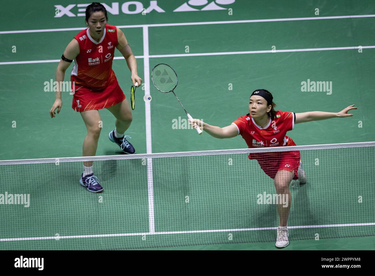 Paris, France. 8th Mar, 2024. Chen Qingchen (R)/Jia Yifan compete during the women's double quarterfinal match between Chen Qingchen/Jia Yifan of China and Treesa Jolly/Gayatri Gopichand Pullela of India at French Open Badminton tournament in Paris, France, March 8, 2024. Credit: Aurelien Morissard/Xinhua/Alamy Live News Stock Photo