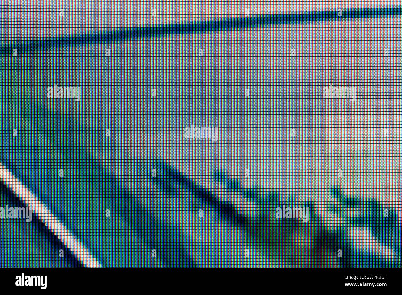 A magnified look at the pixels of an LCD screen, dark green grey white black creepy scary unnerving digital tech background monitor display texture ma Stock Photo