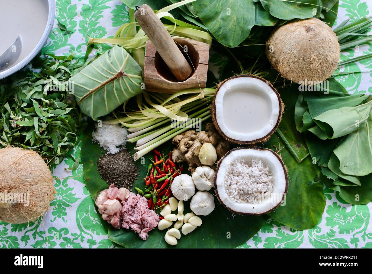 Pinangat. A heritage dish in Bicol Province, Philippines. Organic, healing spices are pounded and wrapped in taro leaves stewed in coconut milk. Stock Photo
