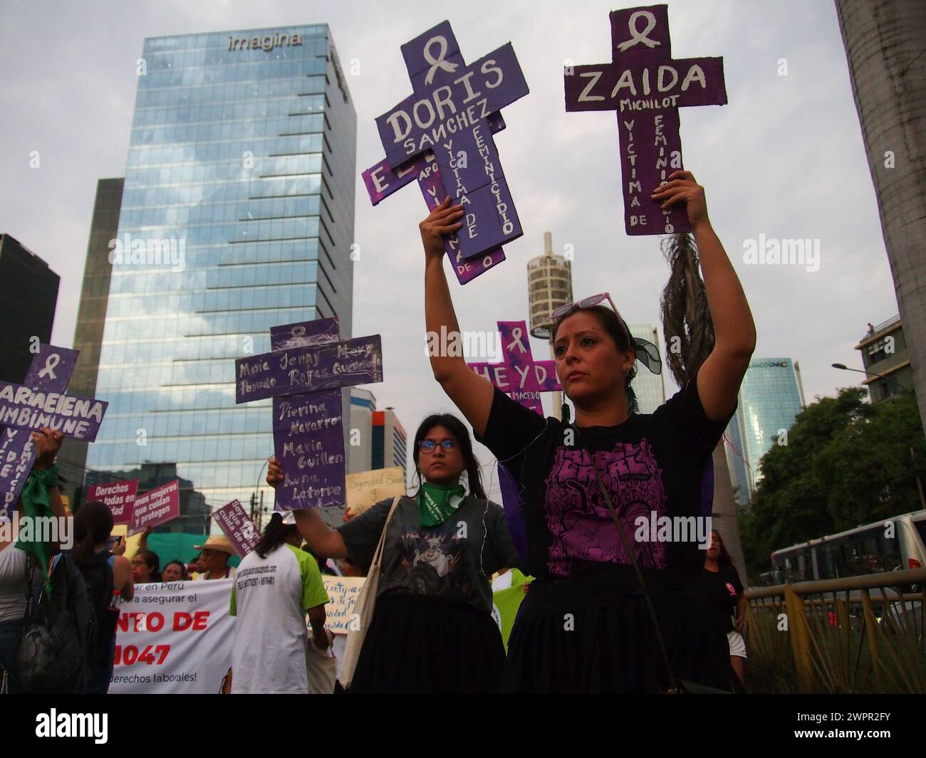 Lima, Peru. 08th Mar, 2024. A woman holding crosses with the names of murdered women when thousands of women took to the streets to march asking for their rights, in the framework of the activities for the International Women's Day which is celebrated internationally every March 8th. Credit: Fotoholica Press Agency/Alamy Live News Stock Photo