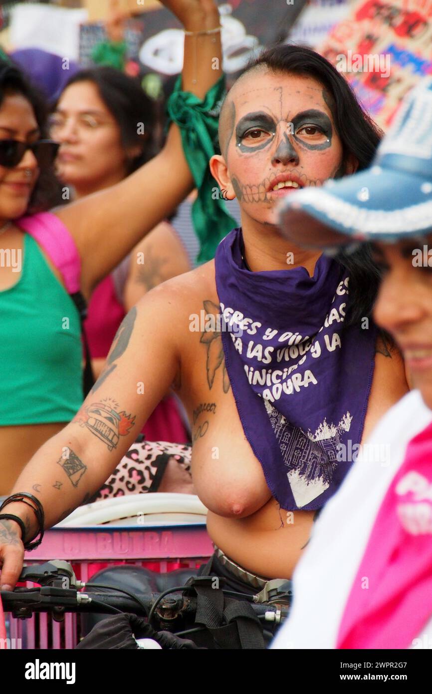 Lima, Peru. 08th Mar, 2024. (EDITORS NOTE: Image contains nudity) A female activist with bare chest and tattooed face thousands of women took to the streets to march asking for their rights, in the framework of the activities for the International Women's Day which is celebrated internationally every March 8th. Credit: Fotoholica Press Agency/Alamy Live News Stock Photo