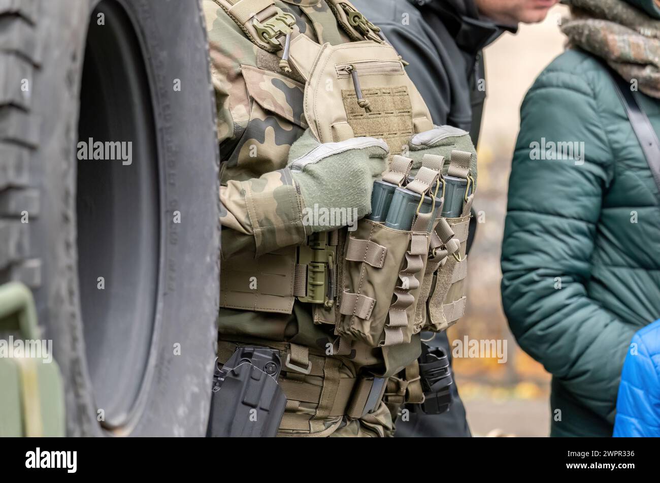 Fully equipped soldier with a generic tactical vest holding many spare