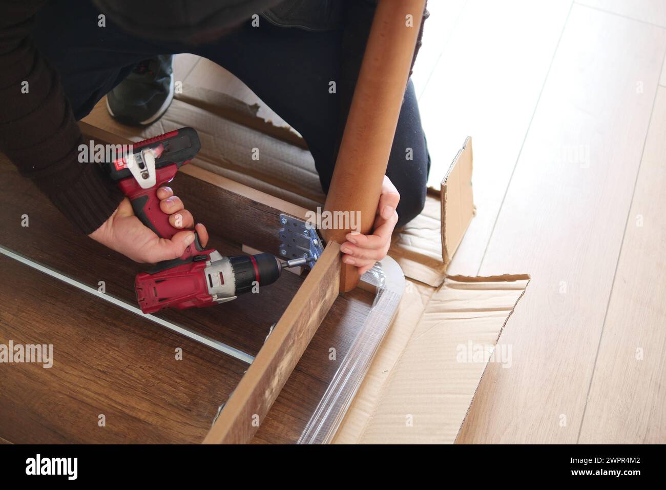 using electric drilling on wooden board  Stock Photo