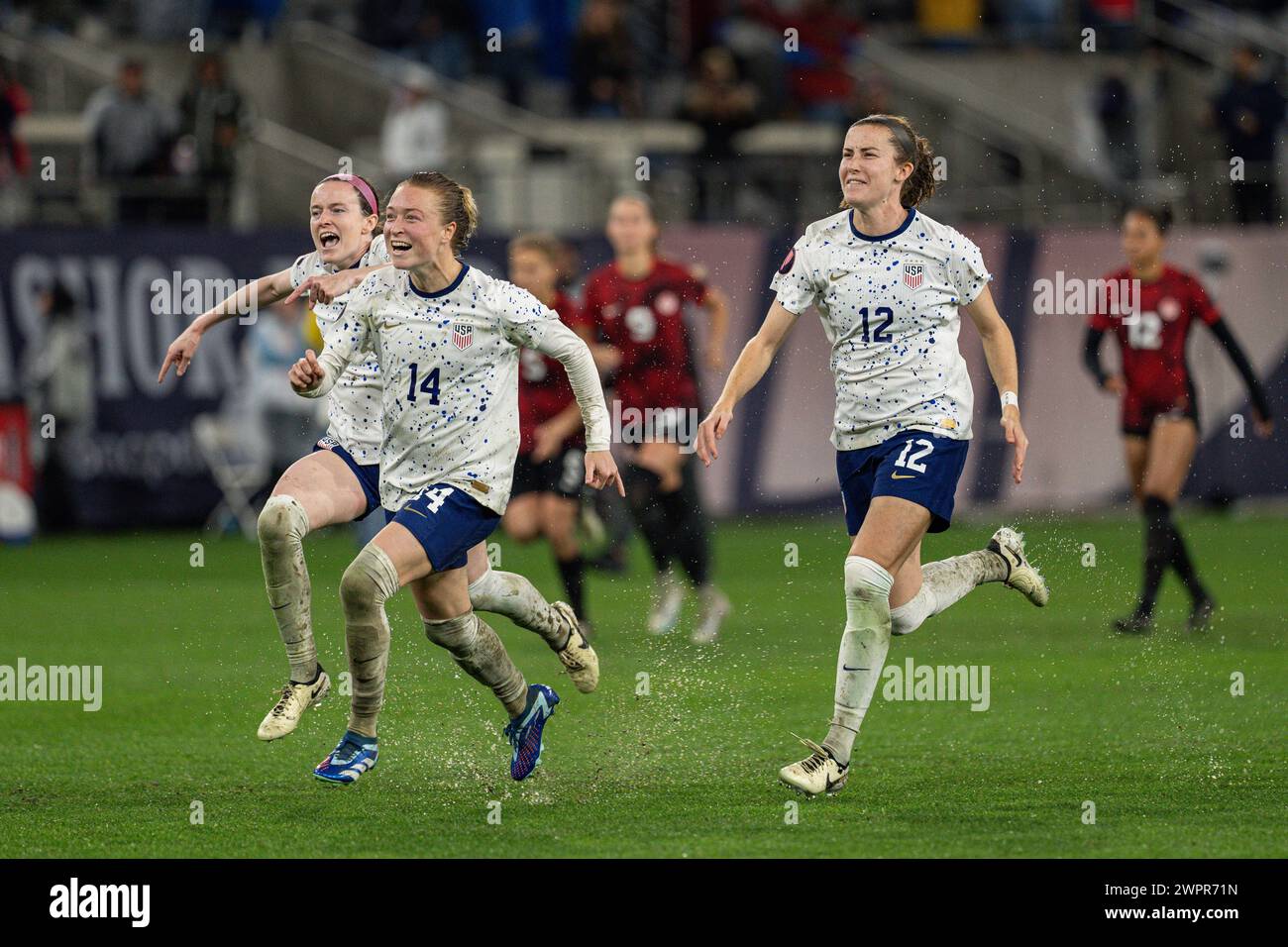 United States midfielder Emily Sonnett (14) celebrates with midfielder Rose Lavelle (16) and defender Tierna Davidson (12) after wining the Concacaf W Stock Photo
