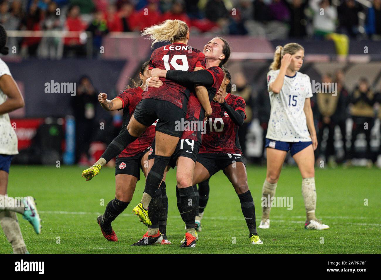 Canada defender Vanessa Gilles (14) celebrates with forward Adriana Leon (19) after she tied the score on a penalty kick during the Concacaf W Gold Cu Stock Photo