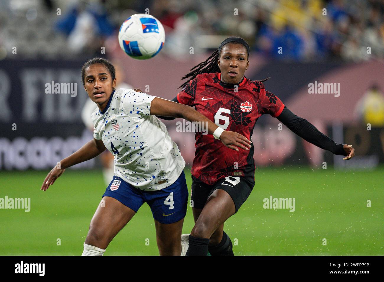 United States defender Naomi Girma (4) and Canada forward Deanne Rose (6) battle for possession during the Concacaf W Gold Cup semifinals match, Wedne Stock Photo