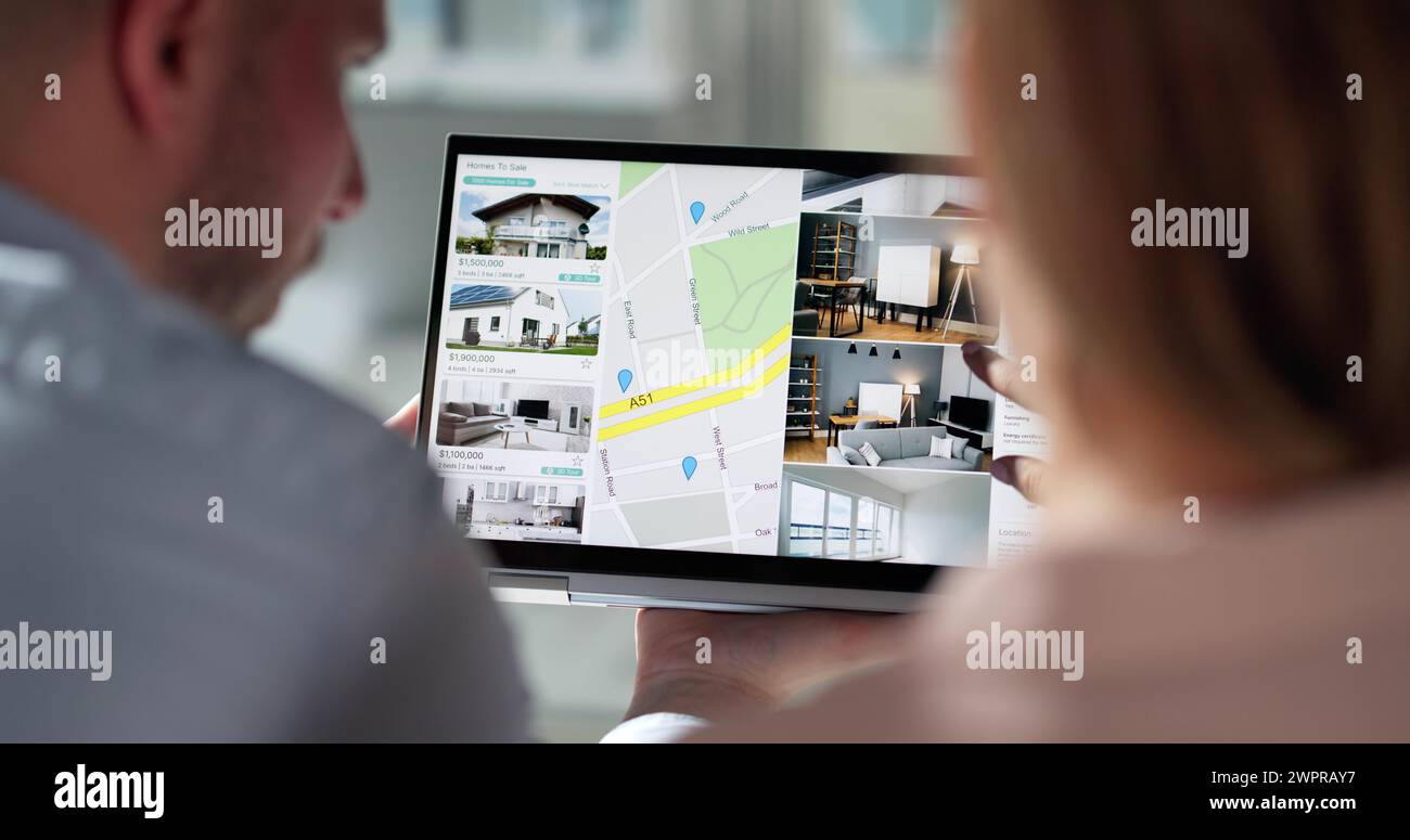 Couple Family Searching Real Estate Property Or House Online Stock Photo