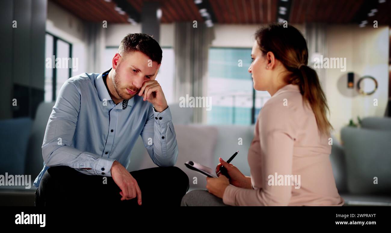 Psychologist Counseling Patient On Couch. Psychiatrist Therapy Stock Photo
