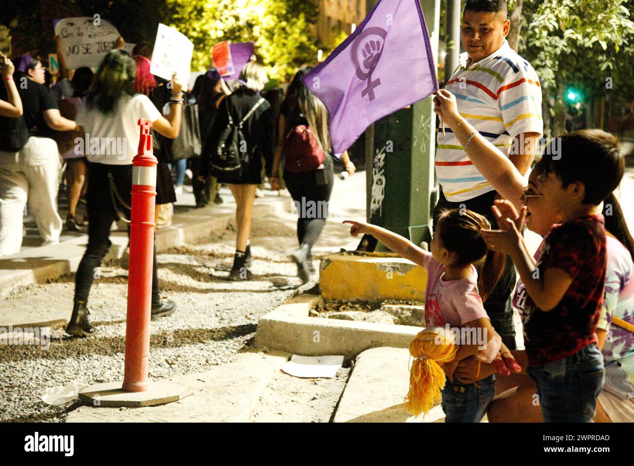 Monterrey, Mexico. 08th Mar, 2024. A family waves to the demonstration during the international women's day demonstrations in, Monterrey, Mexico on March 8, 2024. Photo by: Paola Santoy/Long Visual Press Credit: Long Visual Press/Alamy Live News Stock Photo