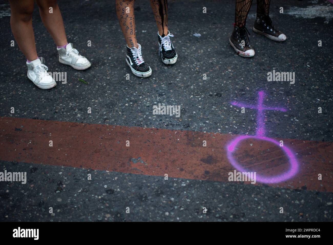 Bogota, Colombia. 08th Mar, 2024. Demonstrators paint the female symbol on the road during the international women's day demonstrations in, Bogota, Colombia on March 8, 2024. Photo by: Chepa Beltran/Long Visual Press Credit: Long Visual Press/Alamy Live News Stock Photo