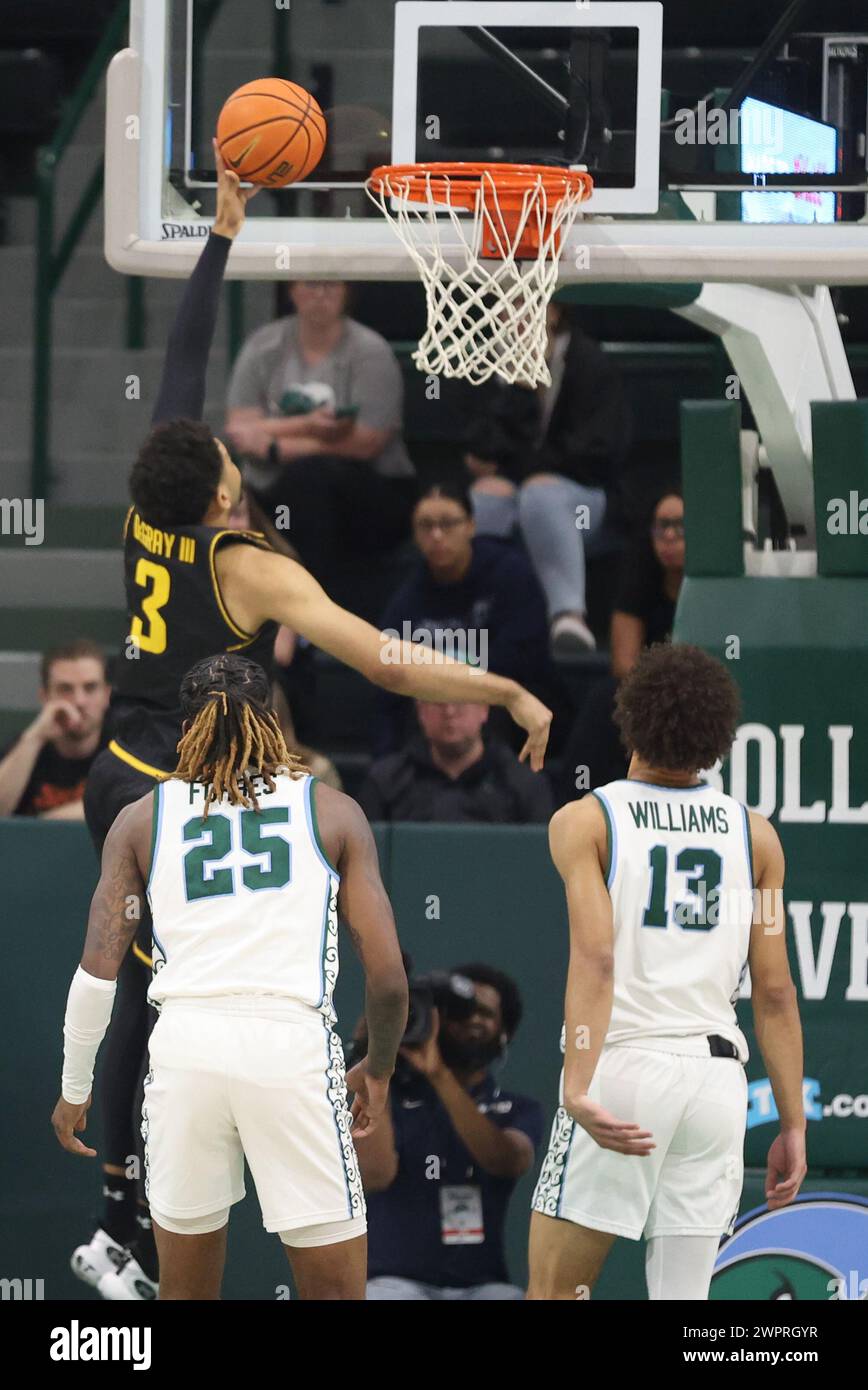 New Orleans, USA. 08th Mar, 2024. Wichita State Shockers forward Ronnie DeGray III (3) shoots a layup against Tulane Green Wave guards Jaylen Forbes (25) and Tre' Williams (13) during an American Athletic Conference men's basketball game at Fogleman Arena in New Orleans, Louisiana on Friday, March 8, 2024. (Photo by Peter G. Forest/Sipa USA) Credit: Sipa USA/Alamy Live News Stock Photo