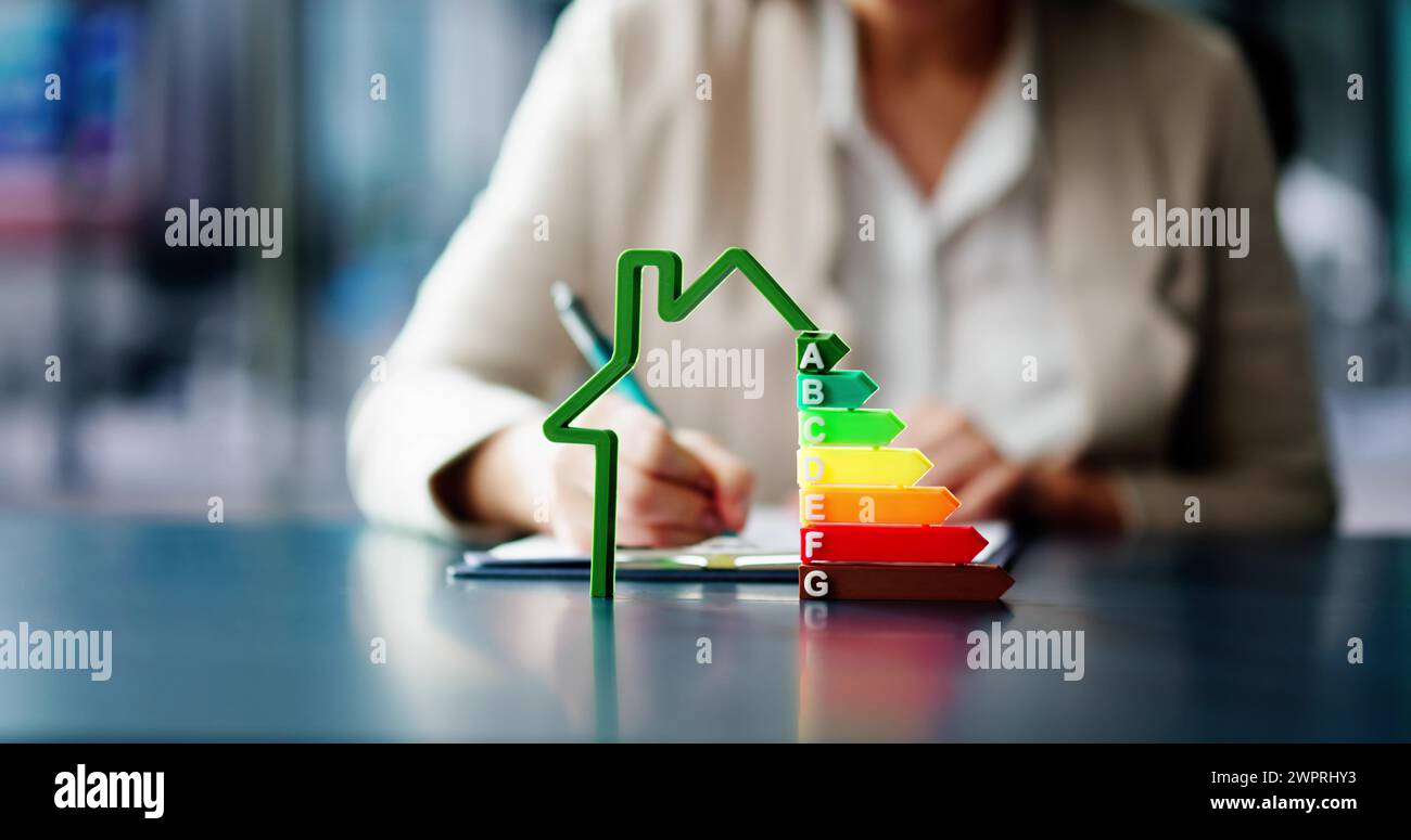 Energy Efficient House Audit Using Calculator. High Efficiency Stock Photo