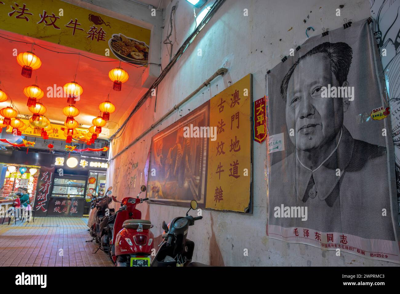 Restaurant displaying posters of Chairman mao, Macau, China. Stock Photo