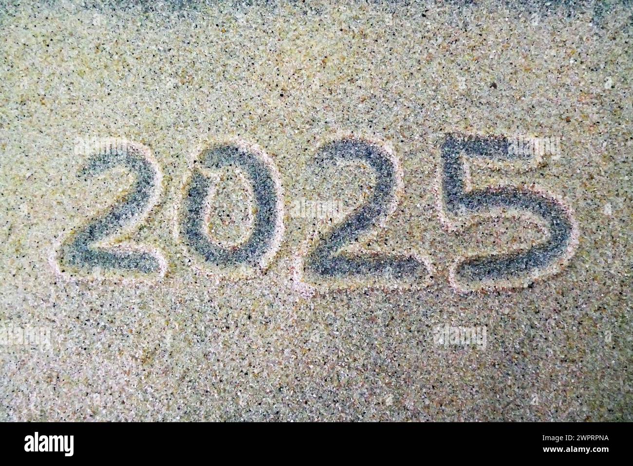 Handwritten New Year 20205 in the sand Stock Photo