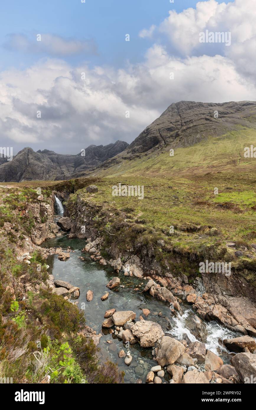 Highland Rocks Crisp waters cascade among scattered rocks in this untouched Highland ...
