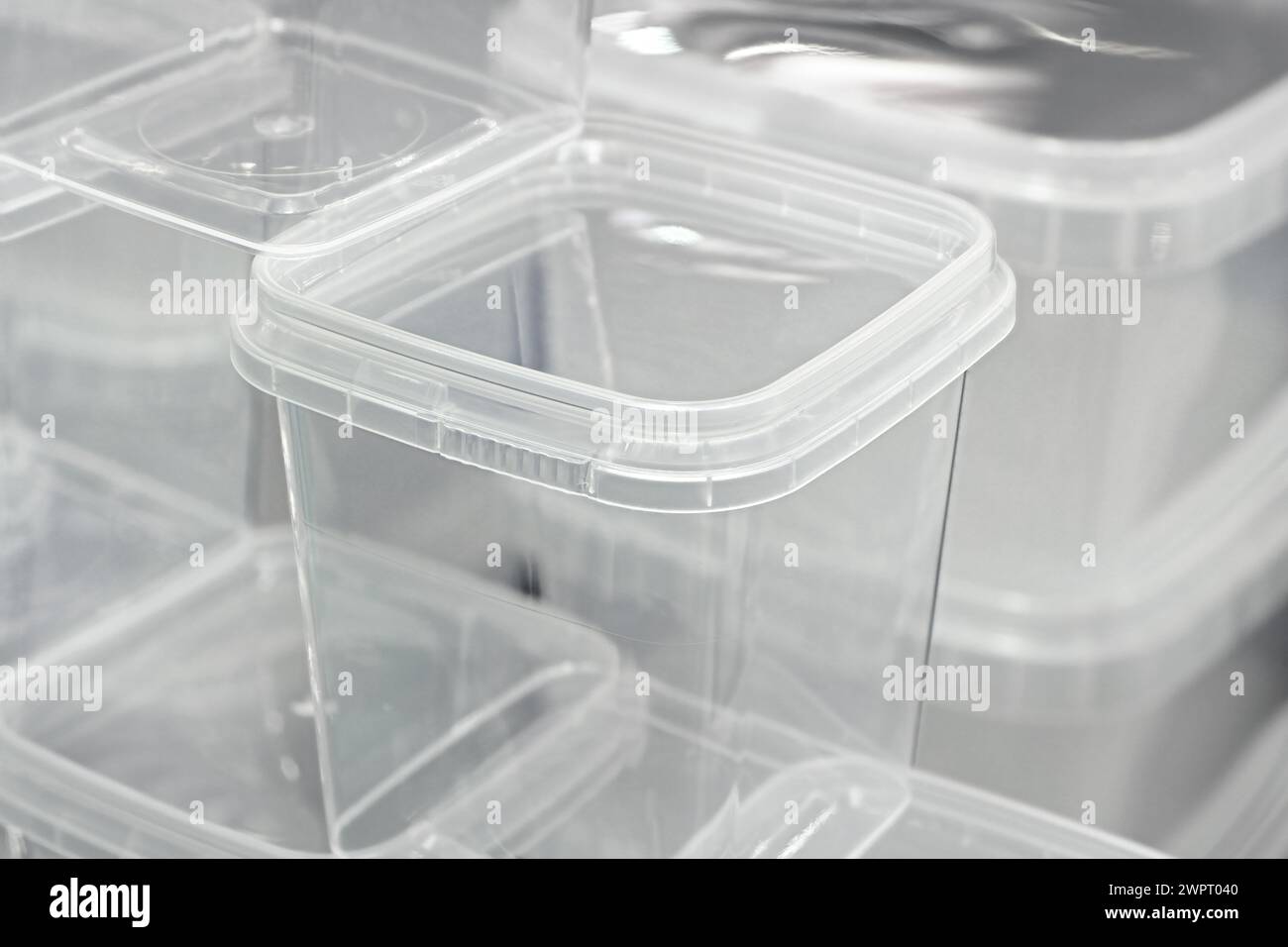 Big group of empty transparent plastic containers. Abstract retail background. Stock Photo
