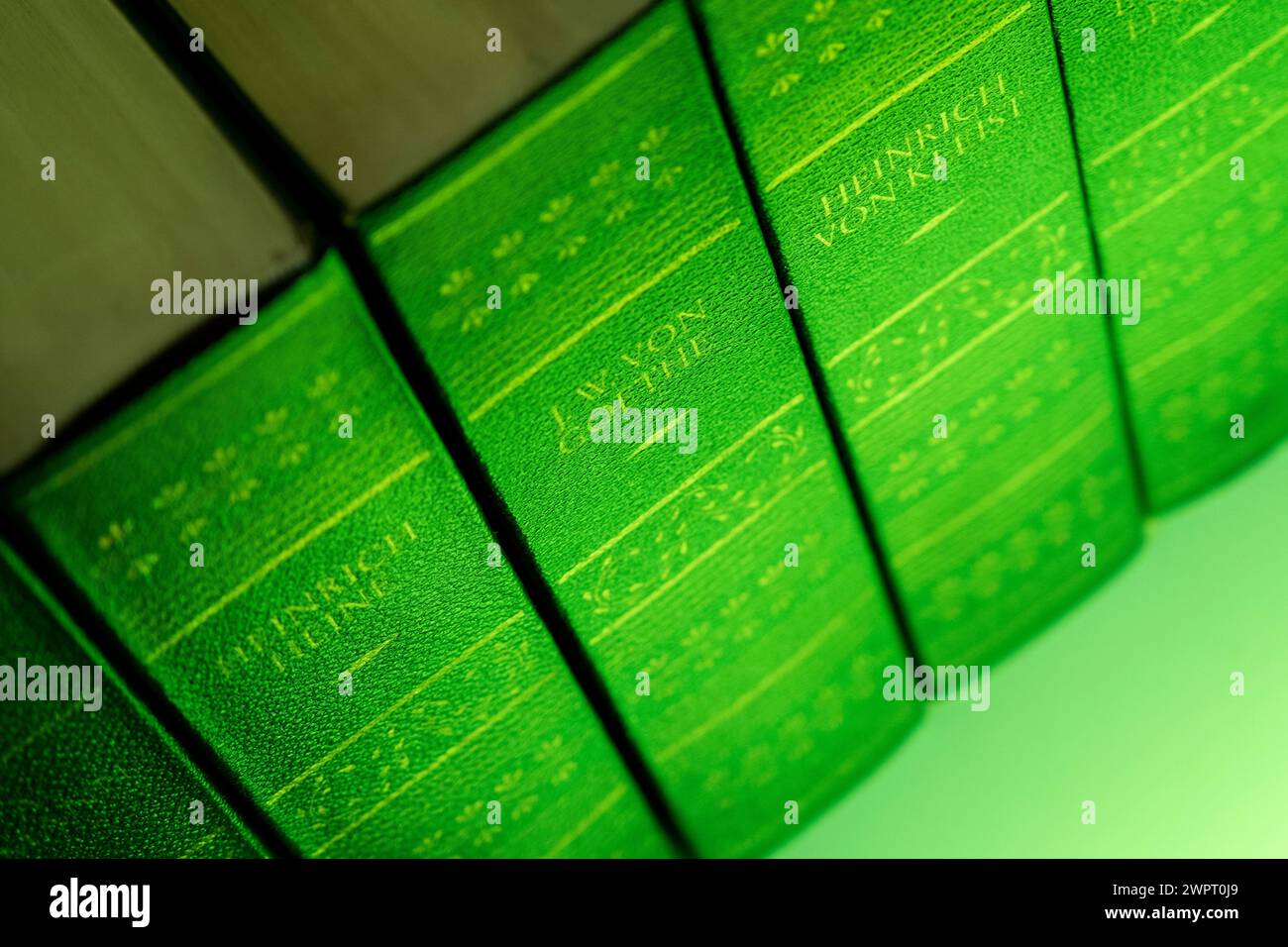 Old books with green covers or book edges are tested for the toxic arsenic. Stock Photo