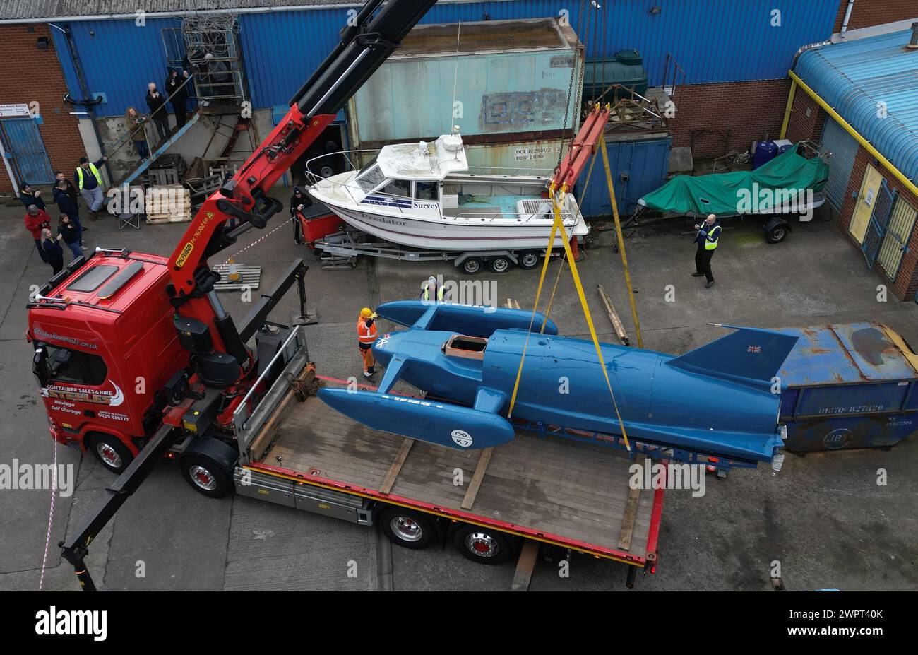 The restored hydroplane boat, Bluebird K7 is loaded onto a lorry in North Shields as it returns to Coniston Water in the Lake District. Picture date: Saturday March 9, 2024. Stock Photo