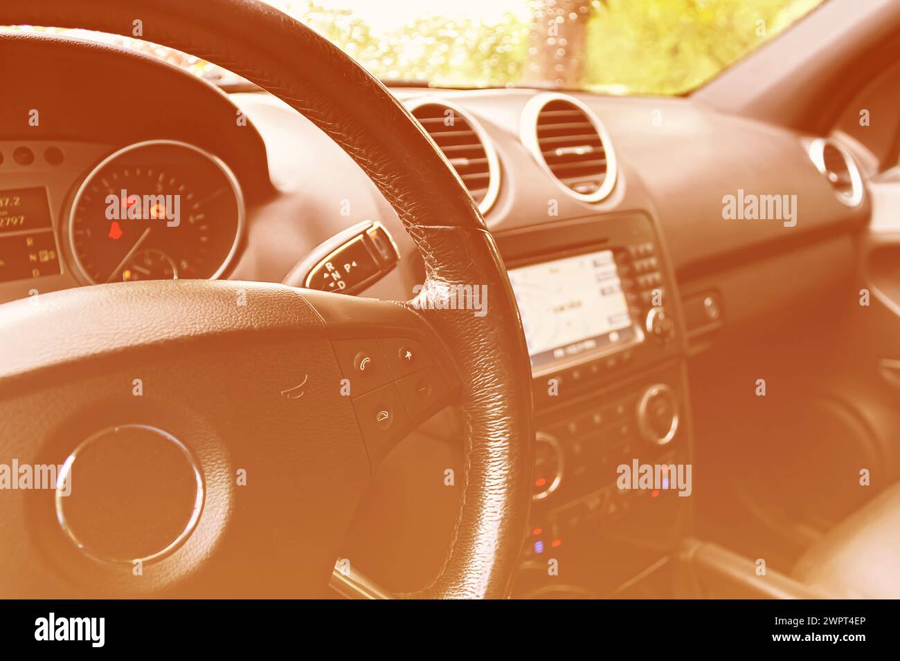 Dashboard car close-up. Steering wheel and many different car buttons ...