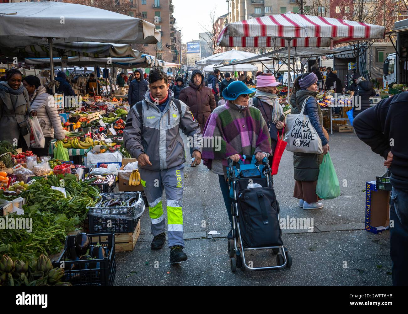Italian people shop Papiniano Market, a large open air market in Milan, Italy. Stock Photo