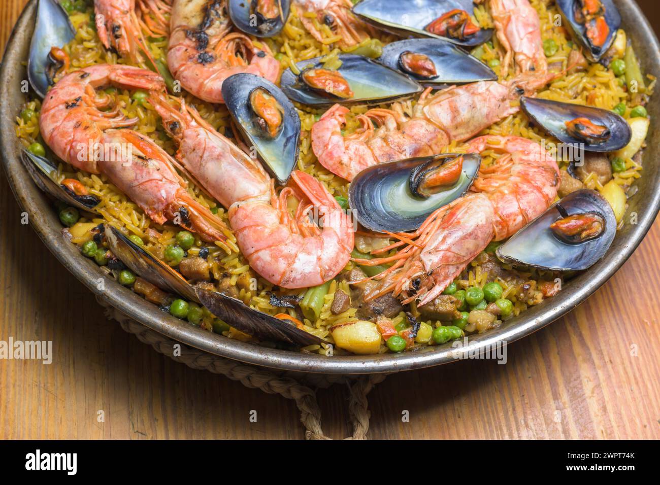 Brightly colored seafood paella presented in a traditional pan, typical Spanish cuisine, Majorca, Balearic Islands, Spain Stock Photo