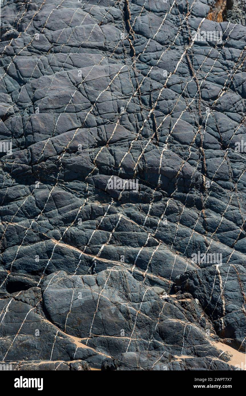 Rock layers on the Portuguese Atlantic coast, geology, grey, monochrome, black, nature, natural stone, rock, earth history, rocks, rocky coast Stock Photo