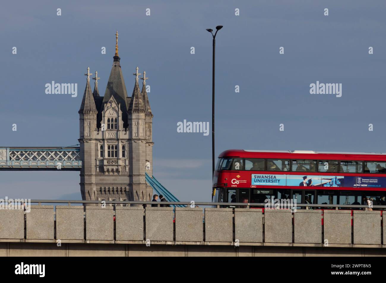 Red london bus crosses tower hi-res stock photography and images - Alamy