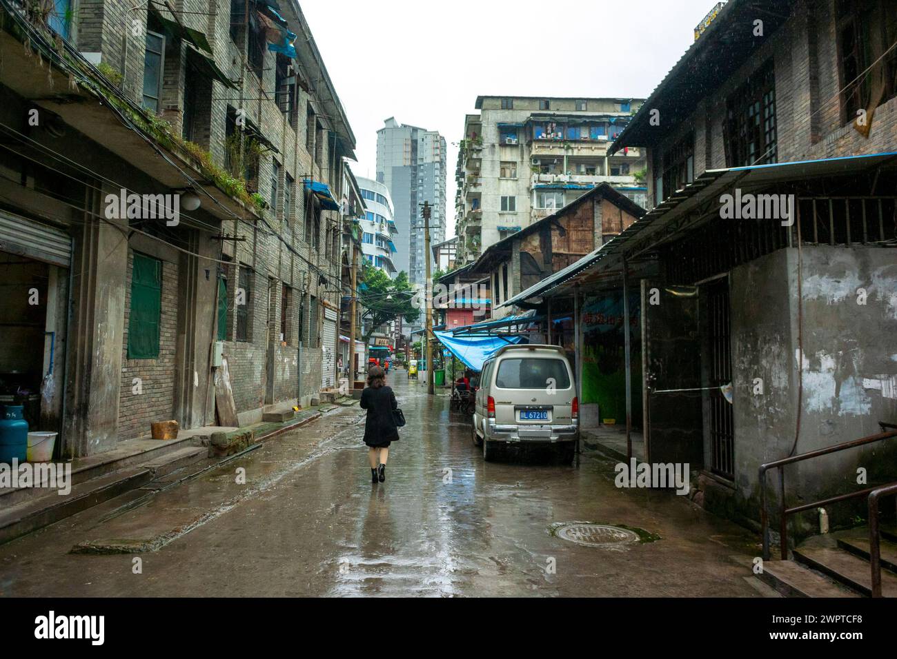 LeSHAN, China, Wide Angle View, Chinese Street Scenes in Old Town Center, in South West Provence, Woman Walking Away, Sichuan Provence Stock Photo