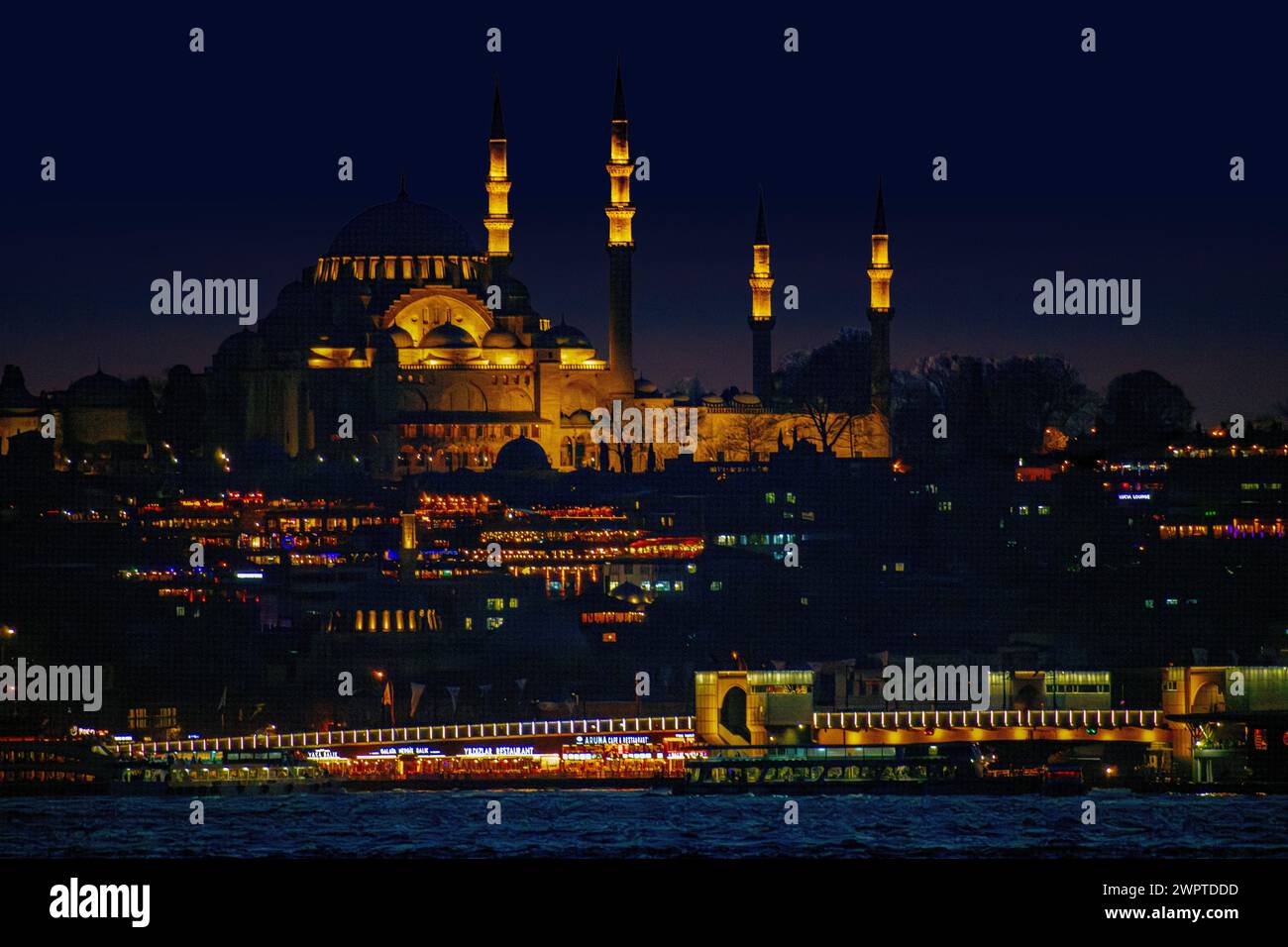 Istanbulat night with Fatih mosque in the distance Stock Photo