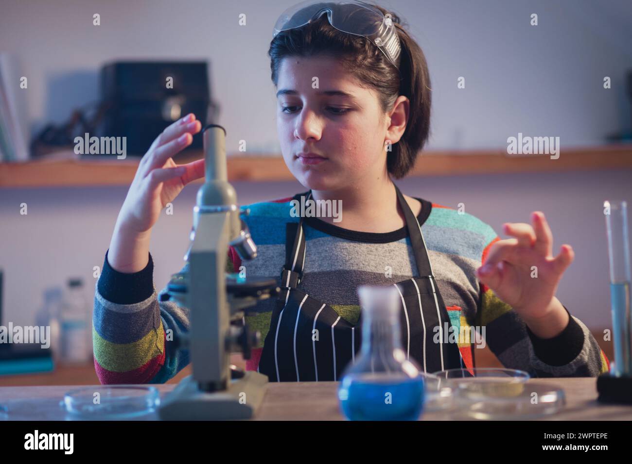 Modern educational program including practical classes. A young chemist ...