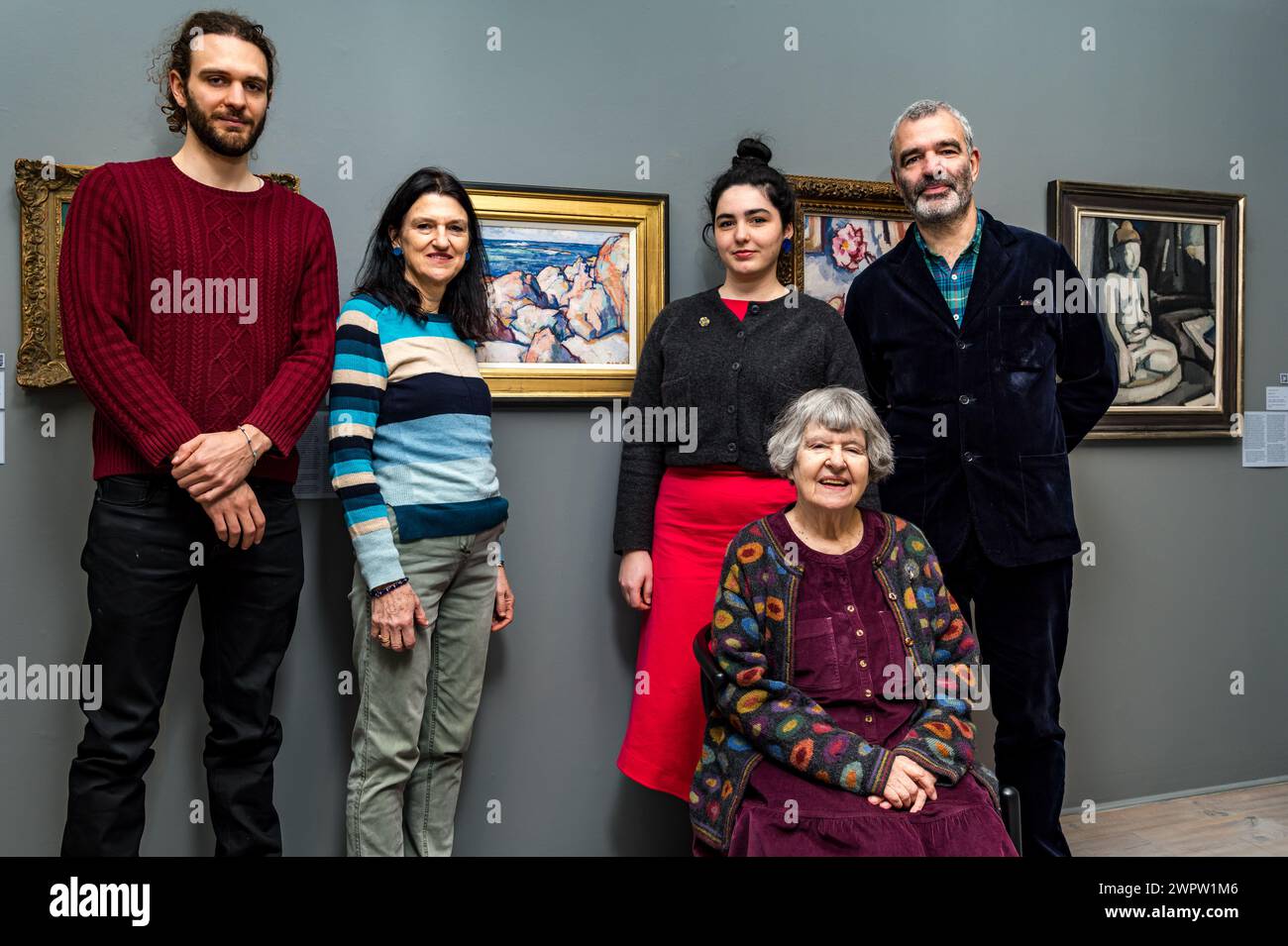 Edinburgh, Scotland, UK, 9th March 2024. The Scottish Gallery: a new exhibition at the New Town art gallery. A Legacy in Colour: The Peploe Family showcases work by Samuel J Peploe and 3 family members: his brother W.W. Peploe, his son Denis Peploe &  Clotilde Peploe (married to SJ's son Willy). Pictured: Mother & grandmother Elizabeth Peploe (seated, wife of Denis Peploe) (L-R) Denis Iannoukos, his mother Lucy Peploe (sister to Guy), Iris Peploe & Guy Peploe (granddaughter and son of Elizabeth). Credit: Sally Anderson/Alamy Live News Stock Photo