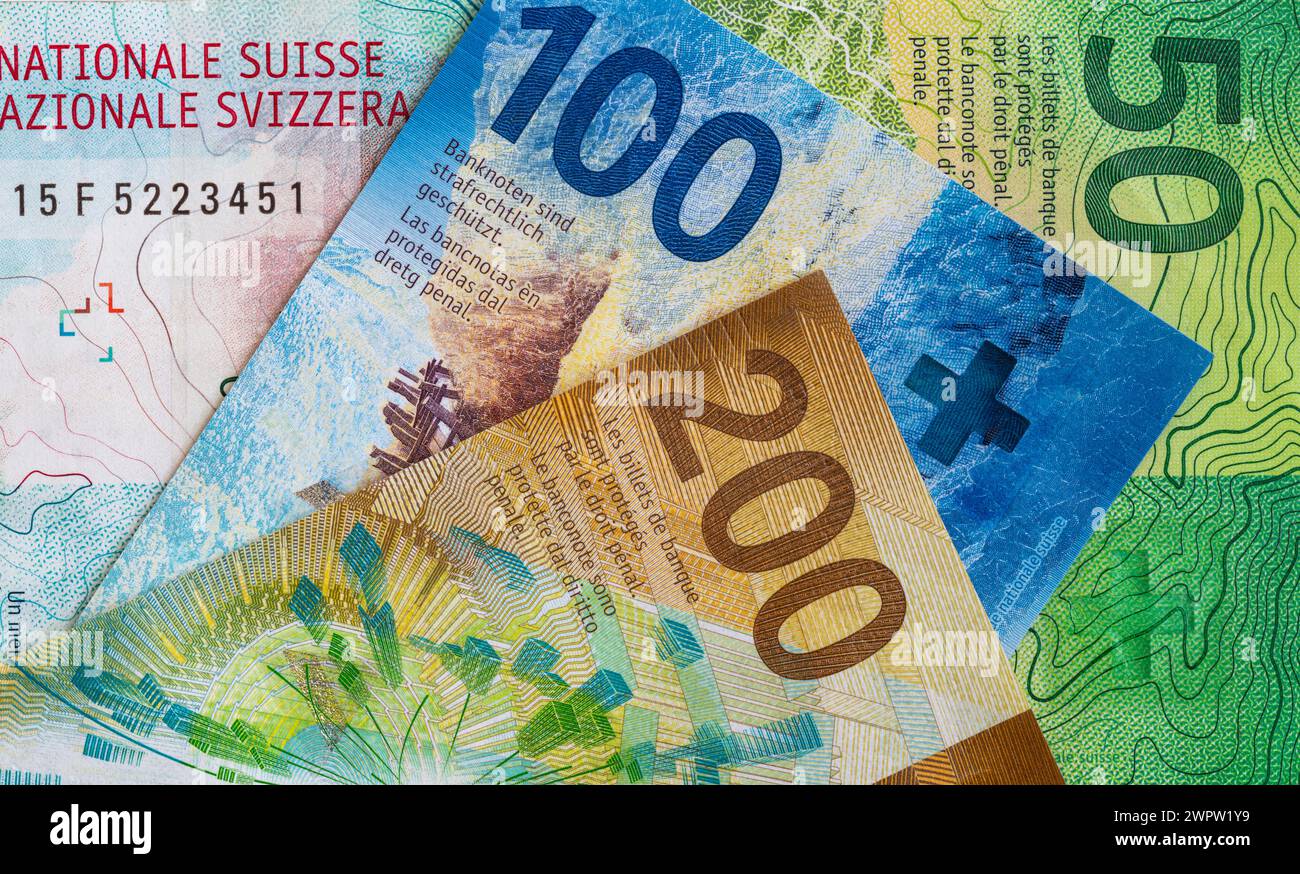 Closeup of 50, 100 and 200 Swiss franc banknotes for design purpose ...