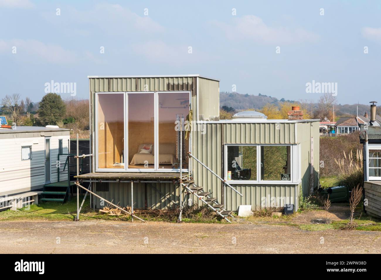 Holiday home behind the beach at Snettisham in Norfolk. Made from green profiled metal sheets. Stock Photo