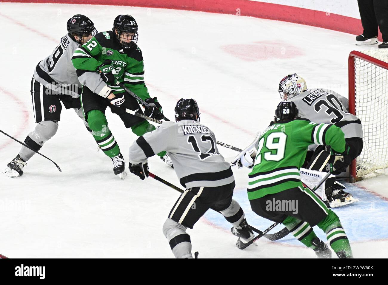 North Dakota Fighting Hawks forward Owen McLaughlin (22) shoots on Omaha Mavericks goaltender Simon Latkoczy (30) during a NCAA men's college hockey game between the University of North Dakota Fighting Hawks and the Omaha Mavericks at Baxter Arena, Omaha, NE on Friday, March 8, 2024. Omaha won 3-2. Photo by Russell Hons/CSM (Credit Image: © Russell Hons/Cal Sport Media) Stock Photo