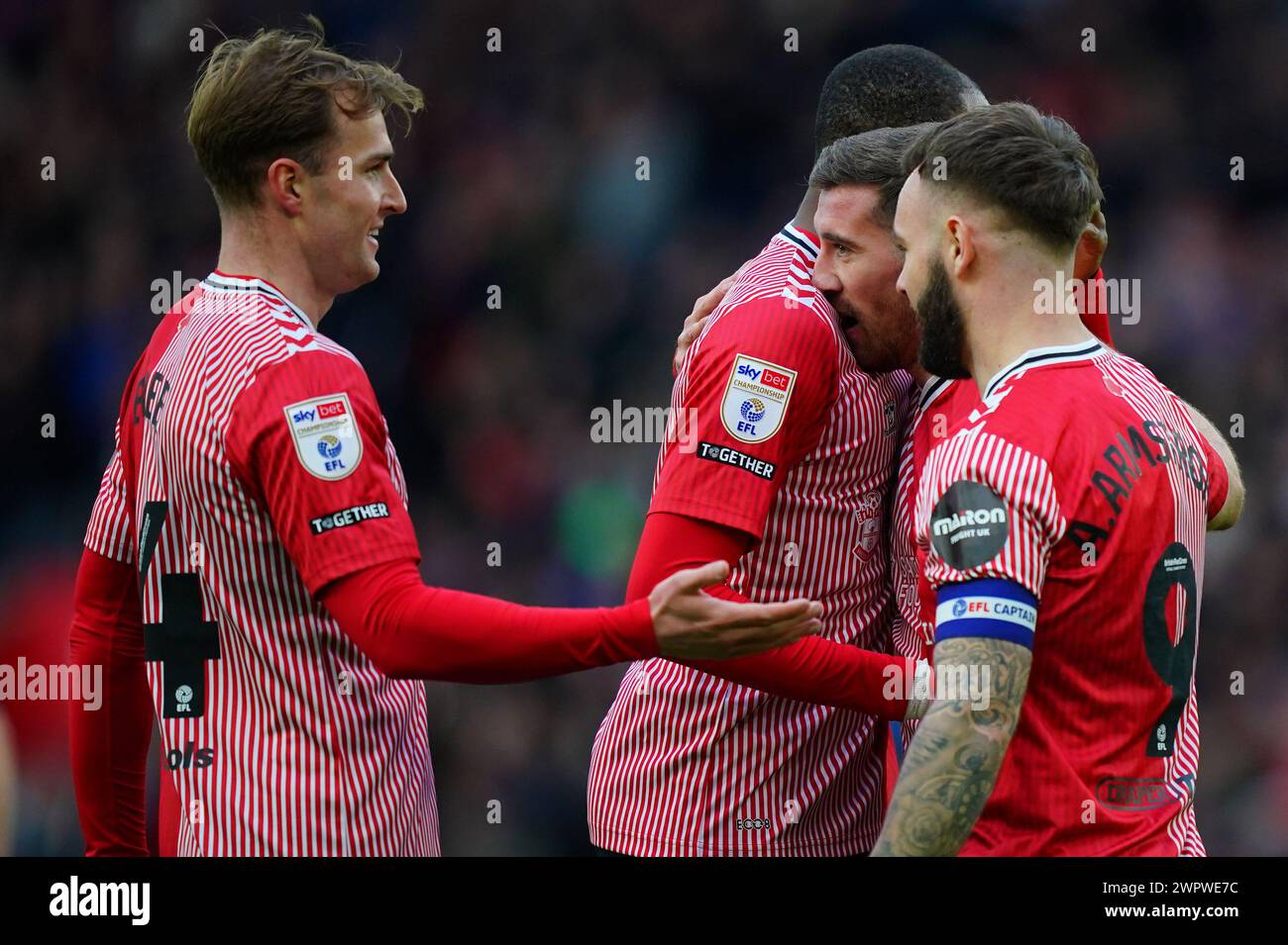 Southampton's Joe Rothwell (second right) celebrates scoring their side's fourth goal of the game along with Southampton's Adam Armstrong (right) during the Sky Bet Championship match at St Mary's Stadium, Southampton. Picture date: Saturday March 9, 2024. Stock Photo