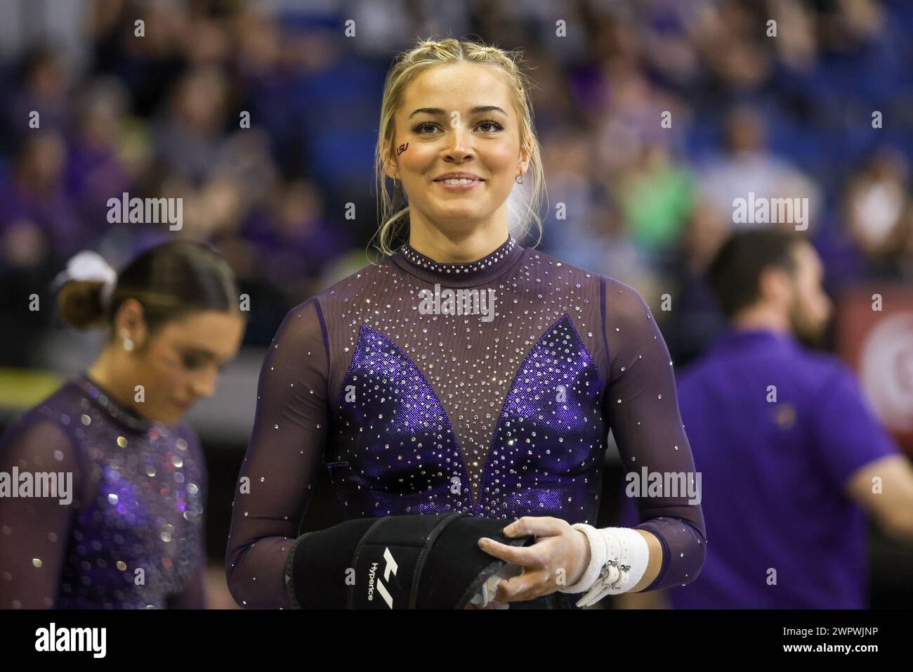 Baton Rouge, LA, USA. 8th Mar, 2024. LSU's Olivia Dunne smiles to a fan