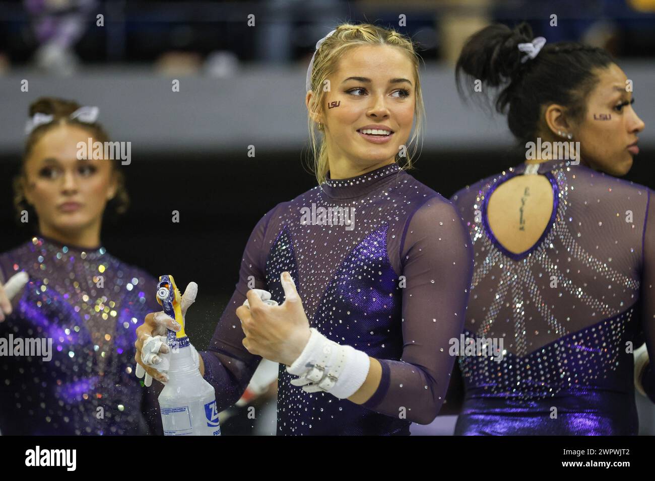 Baton Rouge, LA, USA. 8th Mar, 2024. LSU's Olivia Dunne puts chalk on