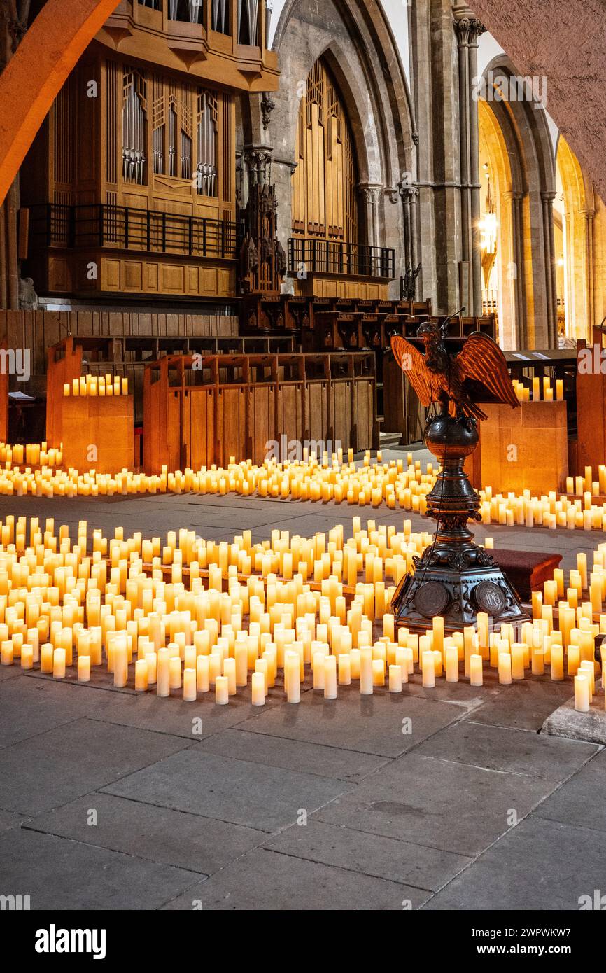 Candle lit interior of Llandaff Cathedral, Cardiff, Wales. Hundreds of candles lighting up
