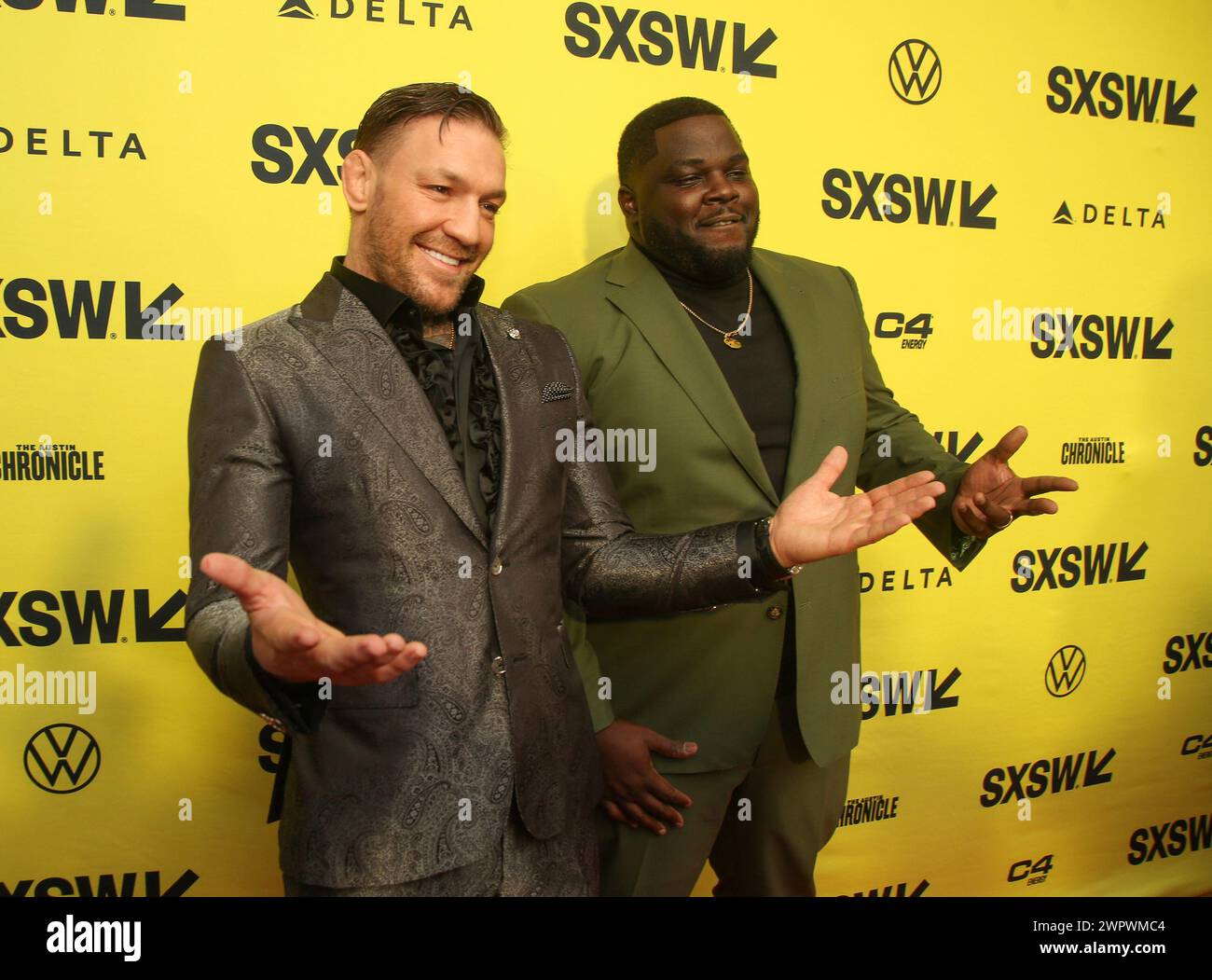 Conor McGregor, left, and Catfish Jean arrive for the world premiere of