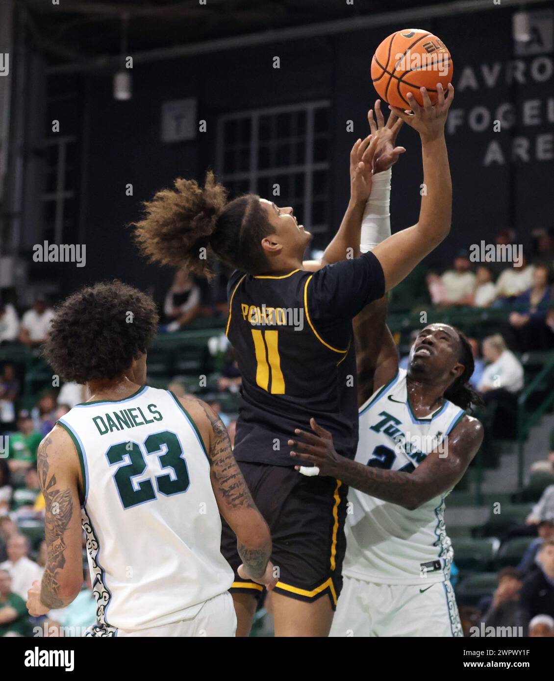 New Orleans, USA. 08th Mar, 2024. Wichita State Shockers forward Kenny Pohto (11) shoots a layup against Tulane Green Wave guard Jaylen Forbes (25) during an American Athletic Conference men's basketball game at Fogleman Arena in New Orleans, Louisiana on Friday, March 8, 2024. (Photo by Peter G. Forest/Sipa USA) Credit: Sipa USA/Alamy Live News Stock Photo