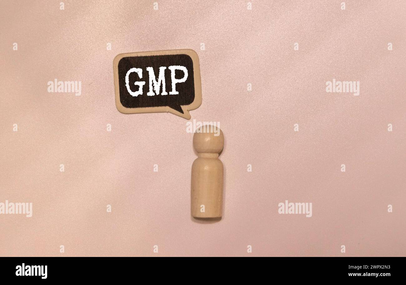 Concept word 'GMP, good manufacturing practice' on cubes on a beautiful dark wooden background. Business concept. Copy space. Stock Photo