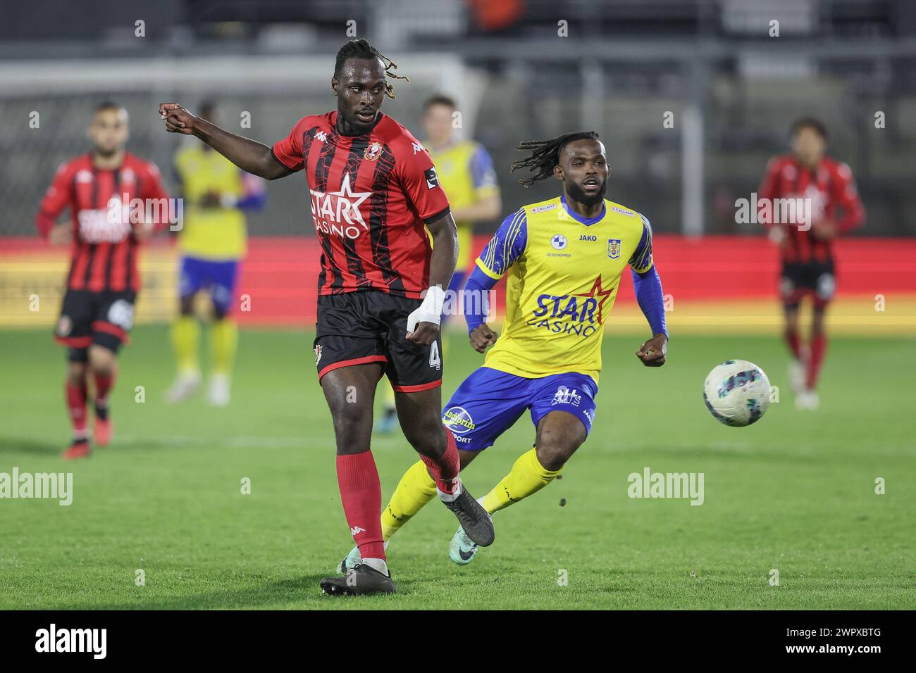 Seraing, Belgium. 09th Mar, 2024. Seraing's Marvin Silver Tshibuabua and Beveren's Goduine Koyalipou fight for the ball during a soccer match between RFC Seraing and SK Beveren, Saturday 09 March 2024 in Seraing, on day 25/30 of the 2023-2024 'Challenger Pro League' second division of the Belgian championship. BELGA PHOTO BRUNO FAHY Credit: Belga News Agency/Alamy Live News Stock Photo