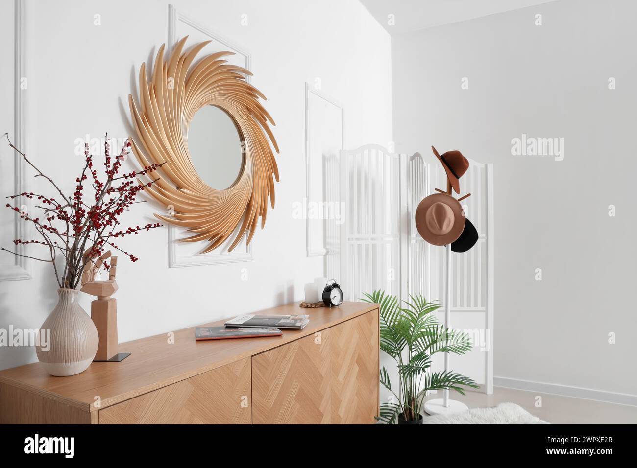 Interior of hall with golden mirror, commode and folding screen Stock ...