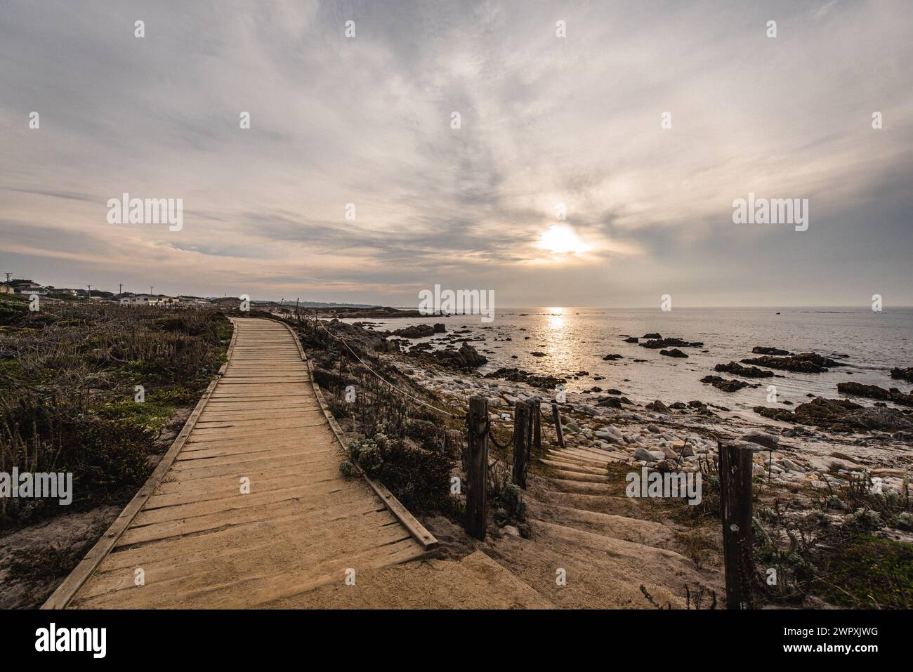 Pathway leading to a quiet beach at sunset near Monterey California Stock Photo