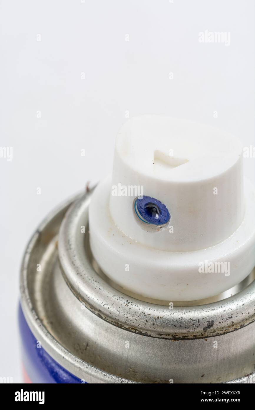 Close shot of spray can nozzle (WD-40 spray). For ingenious devices, handyman concept, graphite spray. Stock Photo