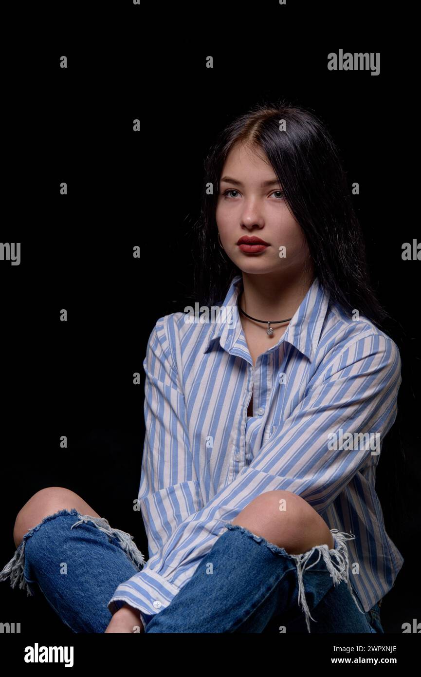 studio portrait of a young girl wearing a striped shirt Stock Photo - Alamy