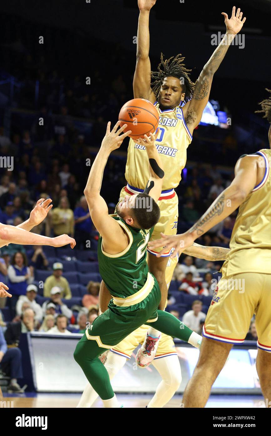 Tulsa guard Jesaiah McWright (0) fouls South Florida guard Jose Placer